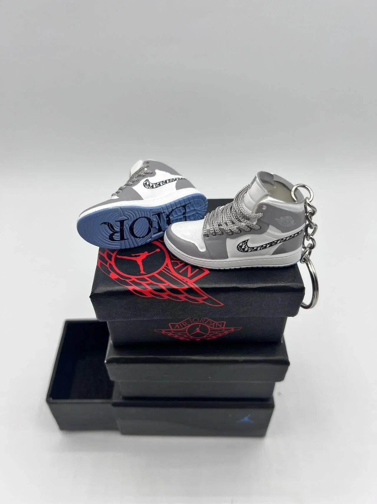 A Pair Of DIOR AIR Jordan 3D Mini Sneaker Keychain Perfect for Nike and Dior Enthusiasts/ With Shoe Box
